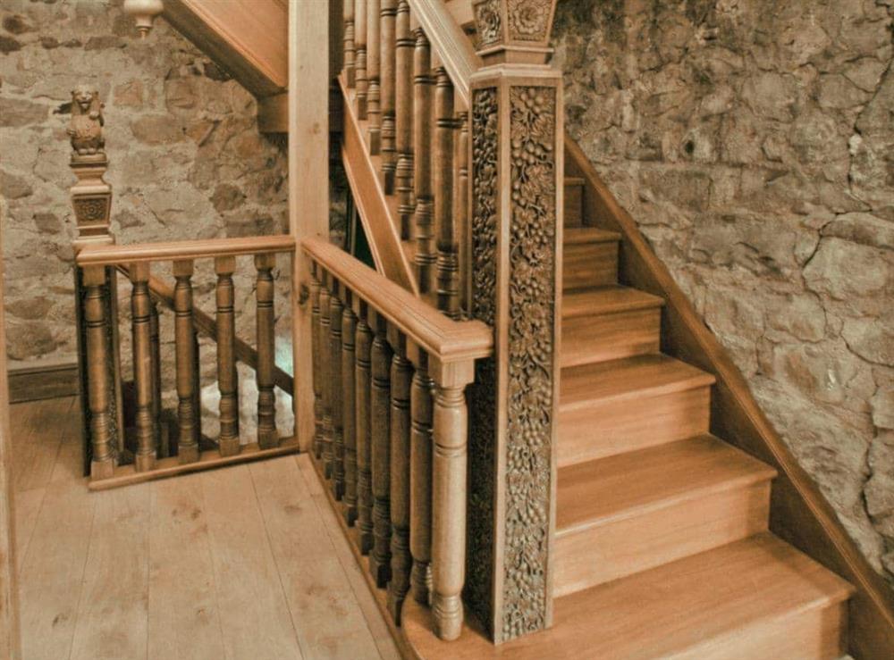 Hand-carved mahogany staircase at Hen Wrych Hall Tower in Abergele, Conwy., Great Britain