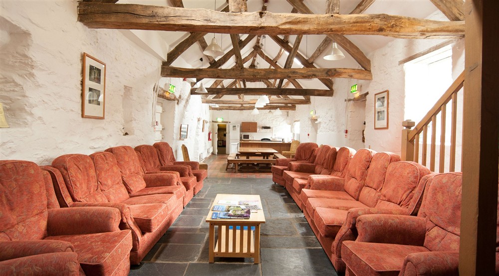 The communal seating area at Hendre Isaf Bunkhouse in Betws-y-coed, Conwy