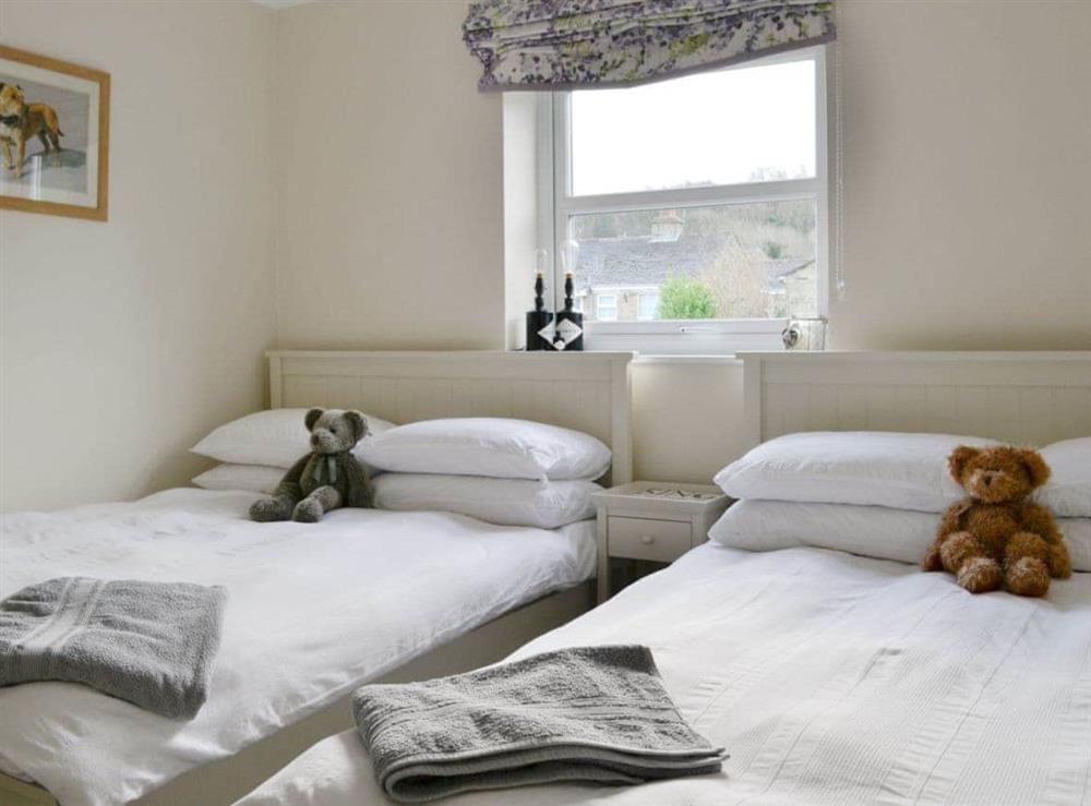Twin bedroom with two double beds at Hendricks Cottage in West Witton, near Leyburn, North Yorkshire