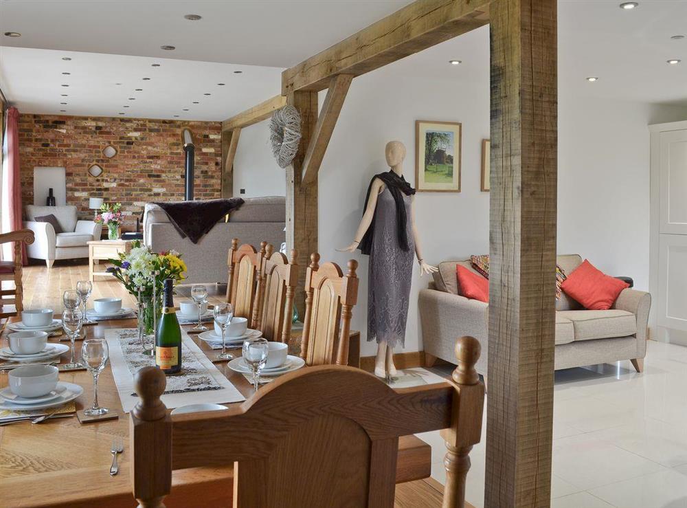 Dining area with exposed wooden beams at Henry Oscar House in Winchelsea, near Rye, Sussex, East Sussex