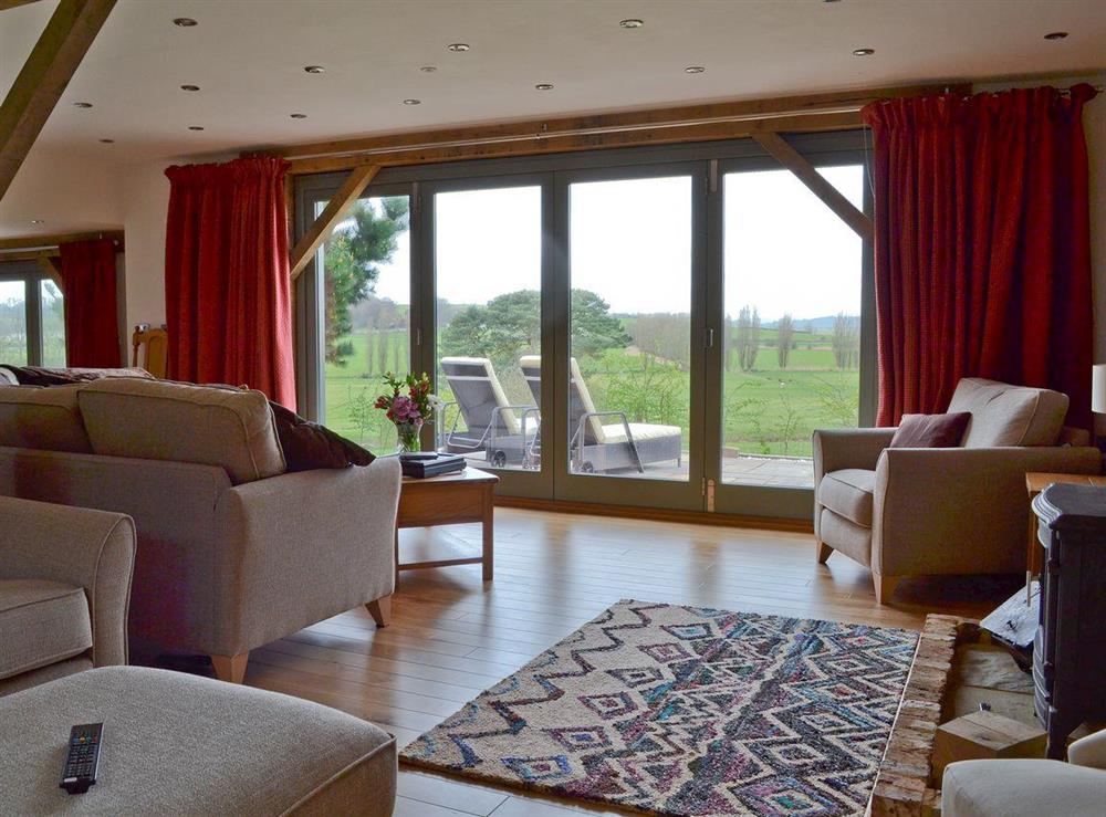 Living space with bi-folding doors at Henry Oscar House in Winchelsea, near Rye, Sussex, East Sussex