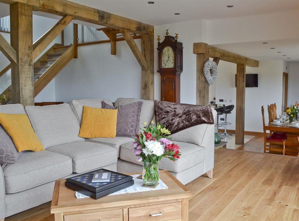 Open plan living space with exposed wood beams at Henry Oscar House in Winchelsea, near Rye, Sussex, East Sussex