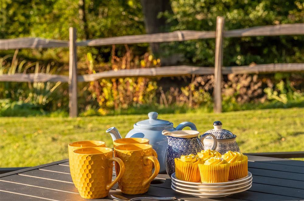 Enjoy afternoon tea in the sunny garden at Hensill Farmhouse, Hawkhurst