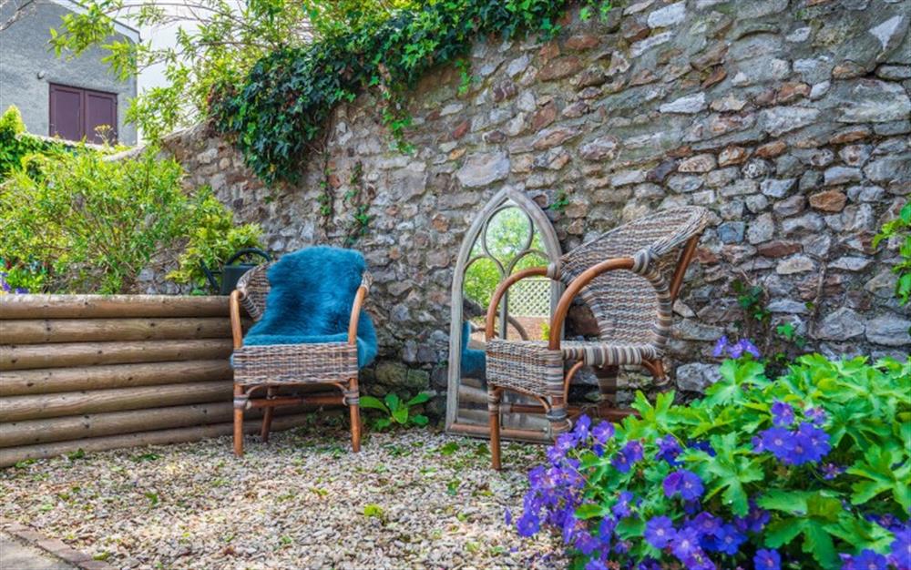 Relax in the walled garden at Herb Cottage in Axminster
