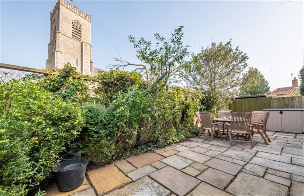 Courtyard garden with views of the church at Herberts, Wells-next-the-Sea