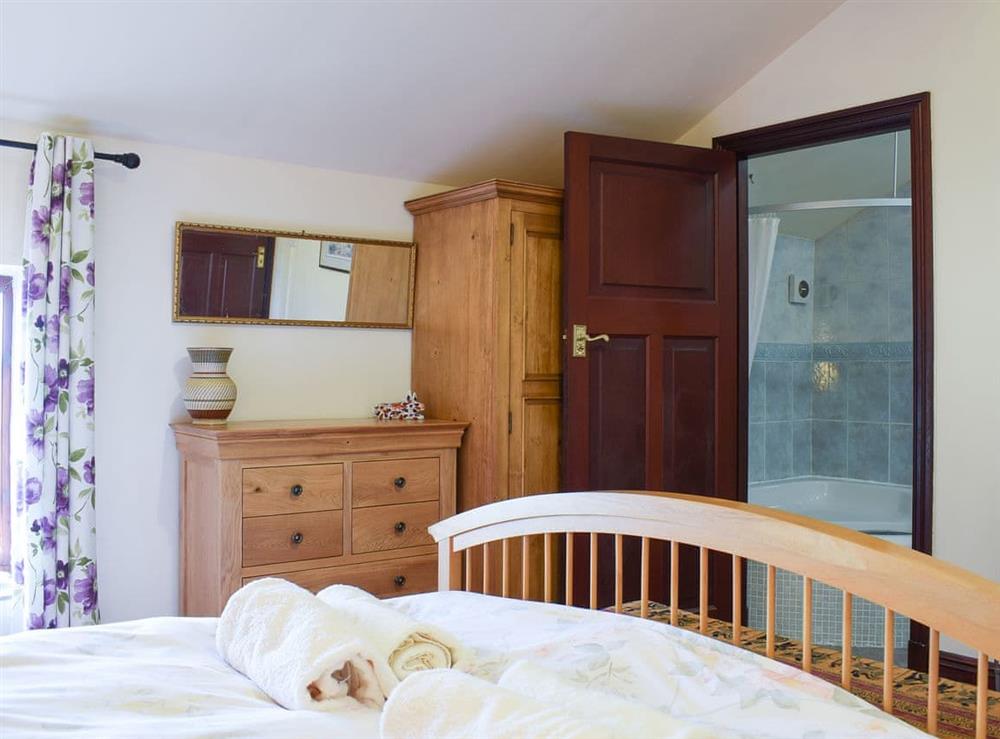 Bedroom boasting an en-suite at Delph, 