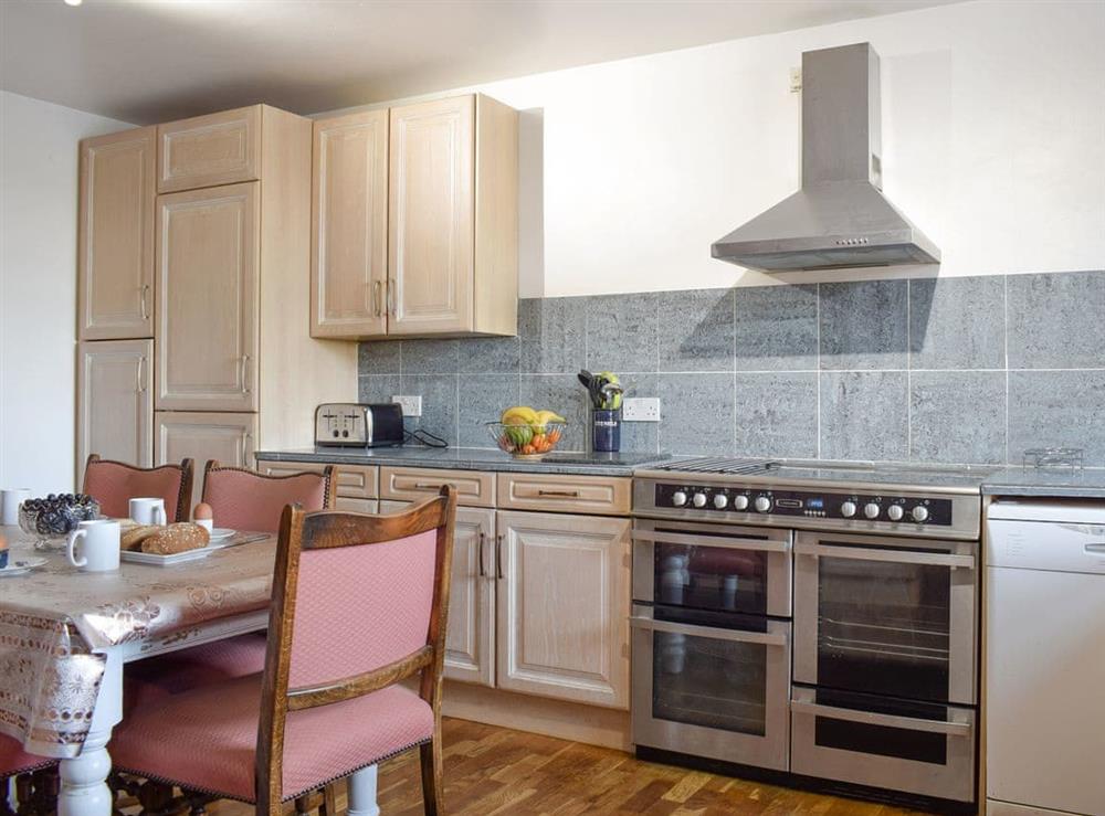 Well-equipped kitchen with dining area at High Gate, 