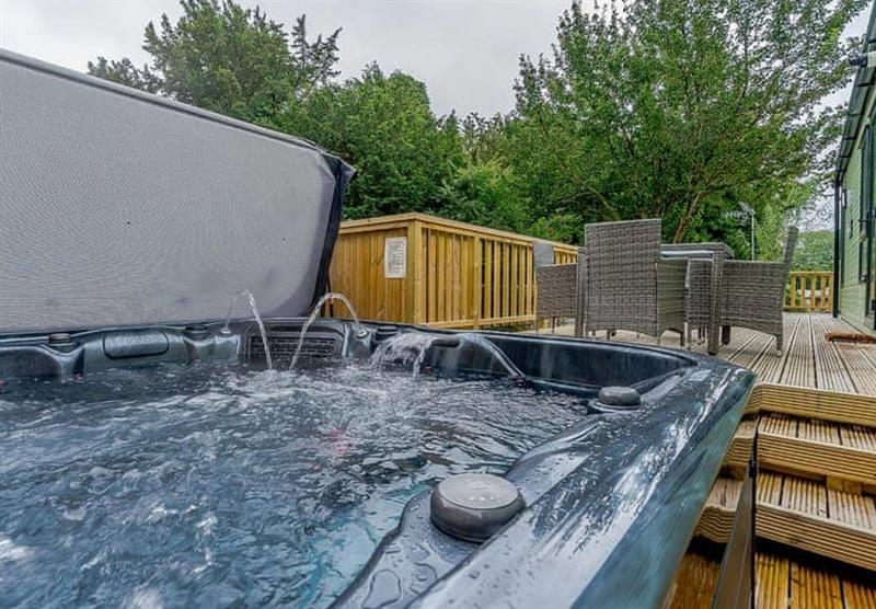 Outdoor hot tub in the Crummock VIP at Herdwick Croft in Bassenthwaite, near Keswick