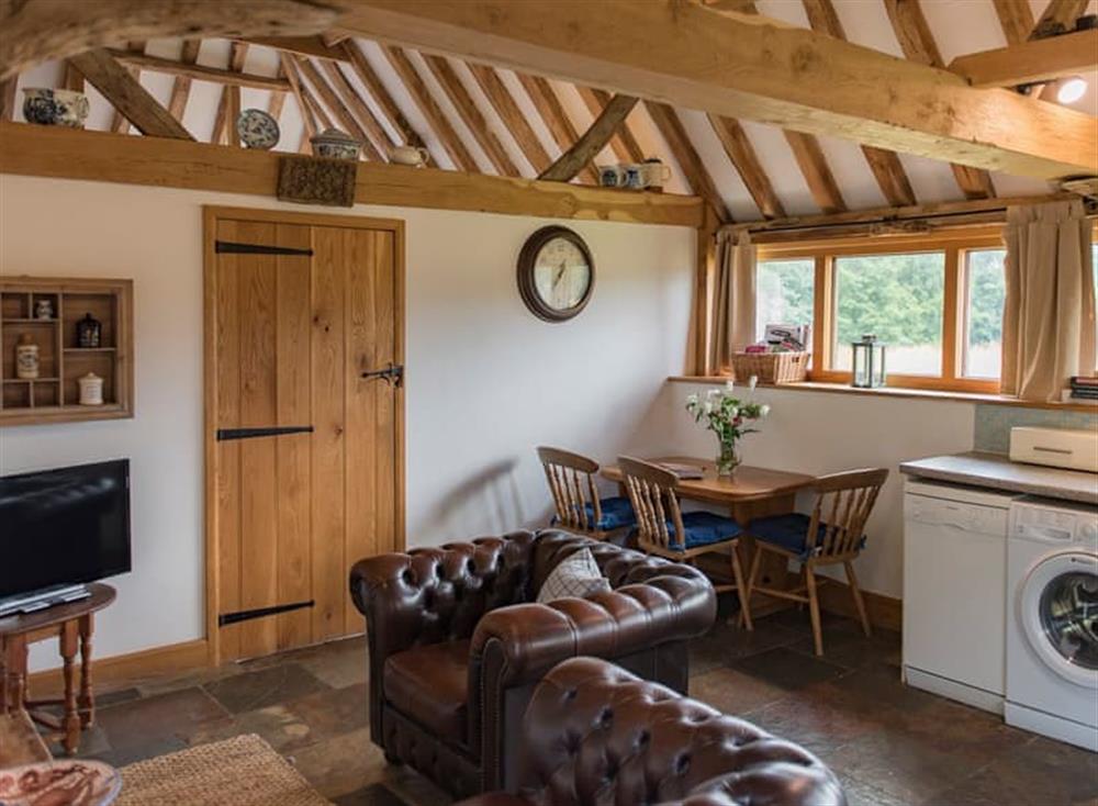 Open plan living space at Heron Barn in Holingbourne, England