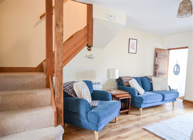 Relax in the living area at Heron Cottage, Colyton