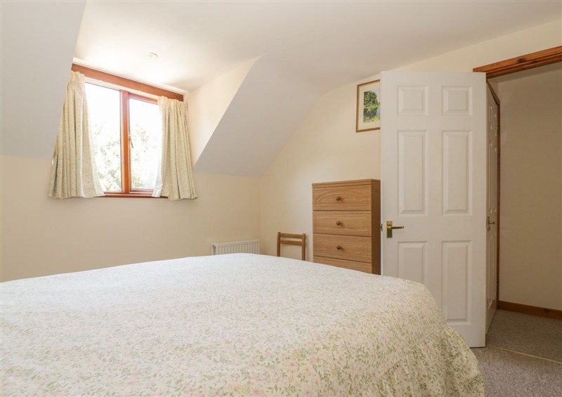A bedroom in Heron Cottage (photo 3) at Heron Cottage, Wayford