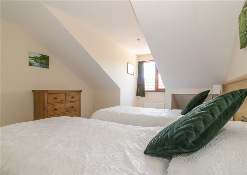 A bedroom in Heron Cottage at Heron Cottage, Wayford