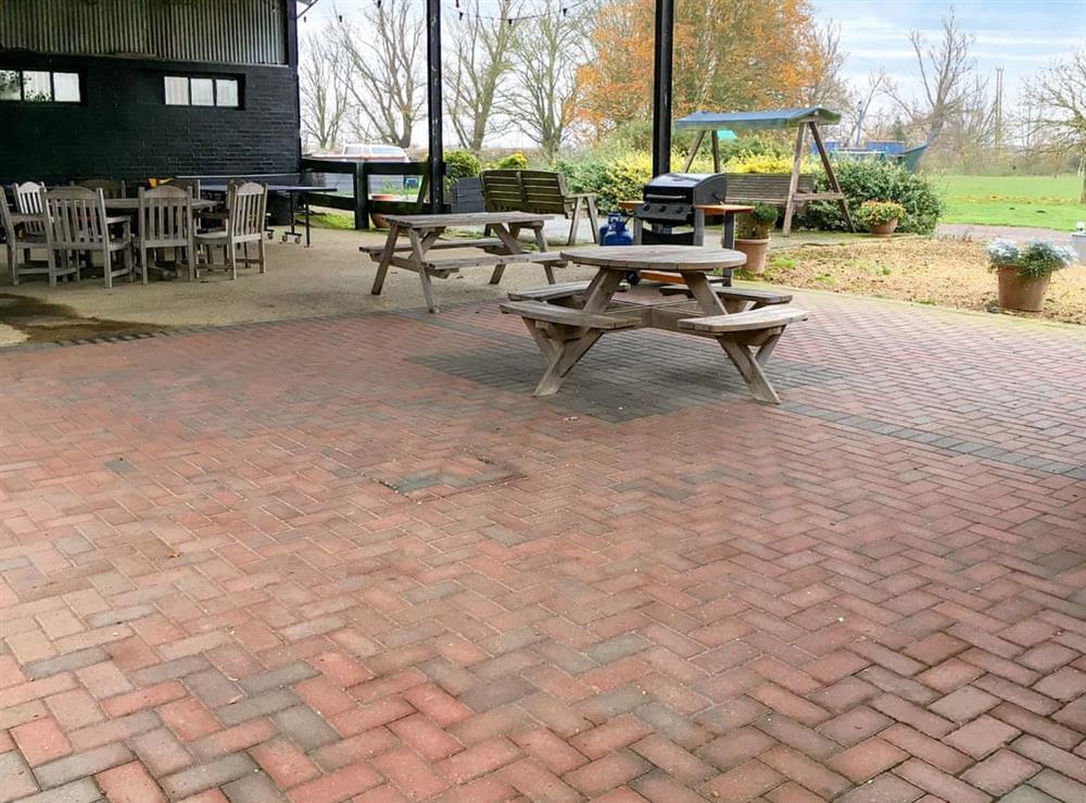 Covered BBQ and seating area at Heron in Ely, Cambridgeshire