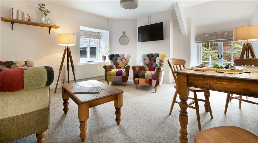 The sitting and dining room at Heron View in Malmsmead, Exmoor