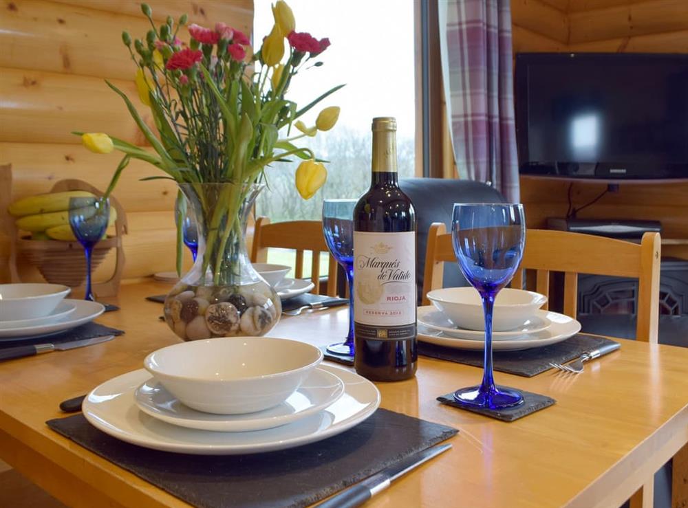 Charming dining area at Herons Log Cabin in Rosebush, Dyfed
