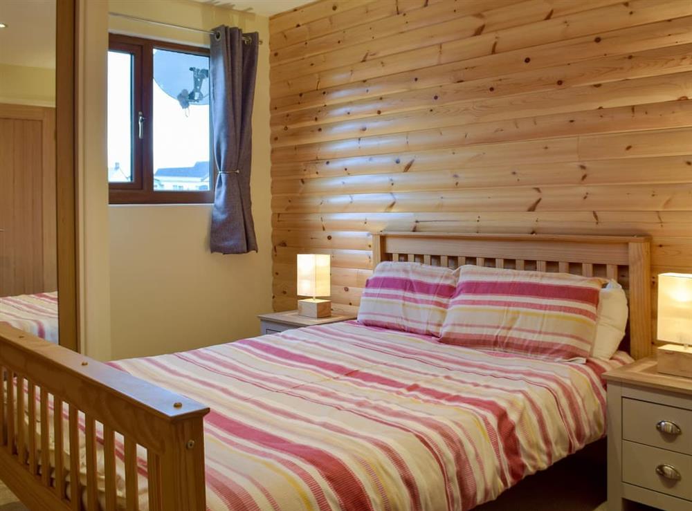 Comfortable double bedroom at Herons Log Cabin in Rosebush, Dyfed