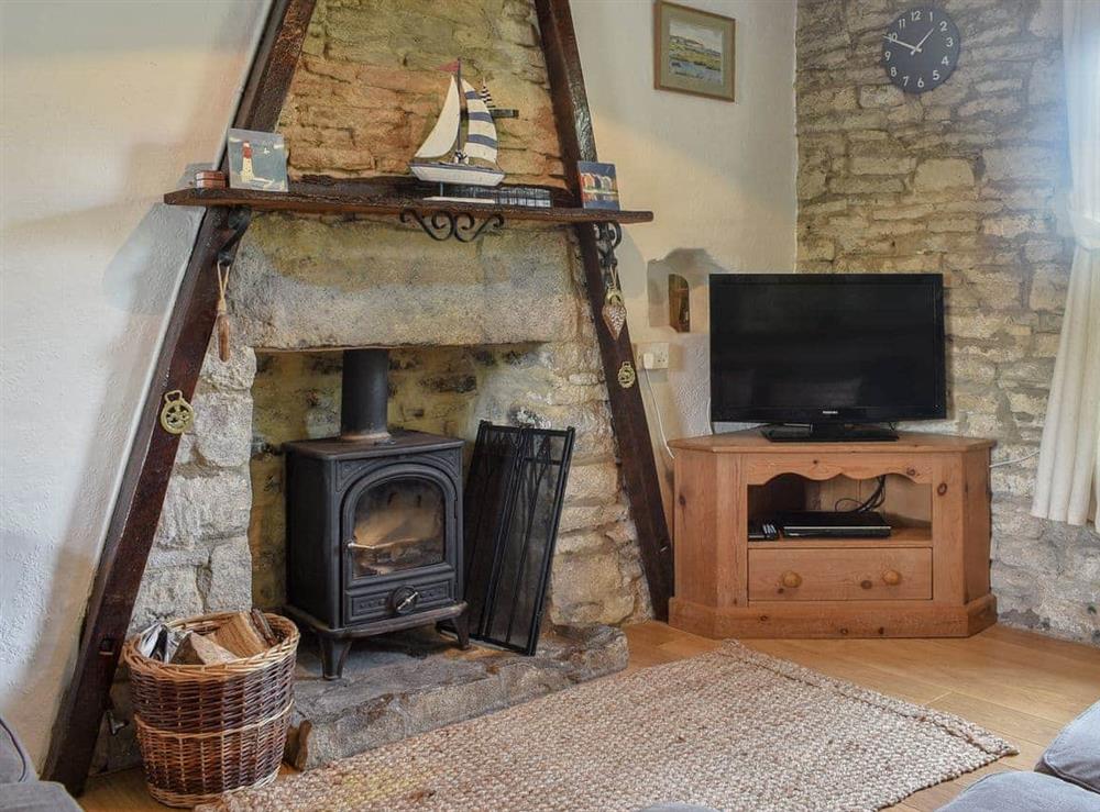Characterful living room with wood burner at Herston Rise in Swanage, Dorset