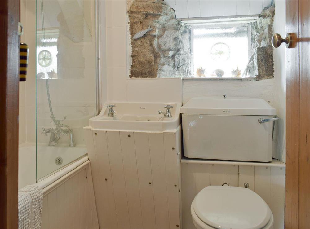 Family bathroom with shower over bath at Herston Rise in Swanage, Dorset