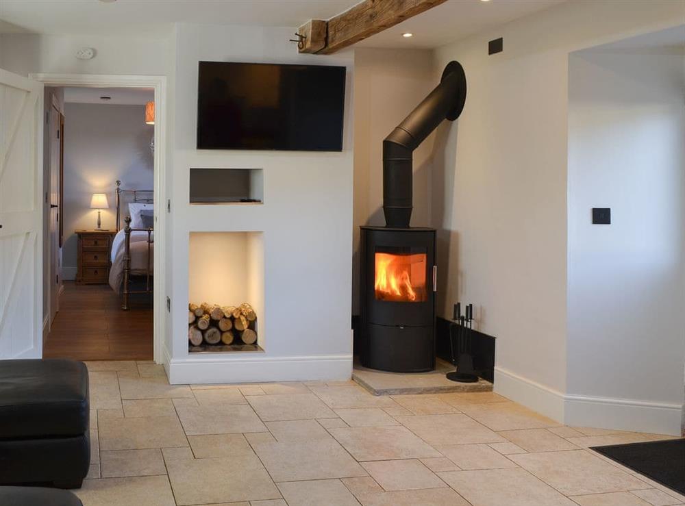 Living room with wood burner at Hetton Byre in near Chatton, Alnwick, Northumberland