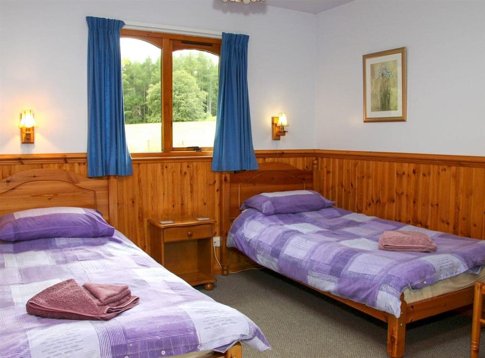 Twin bedroom at Treetops Lodge, 