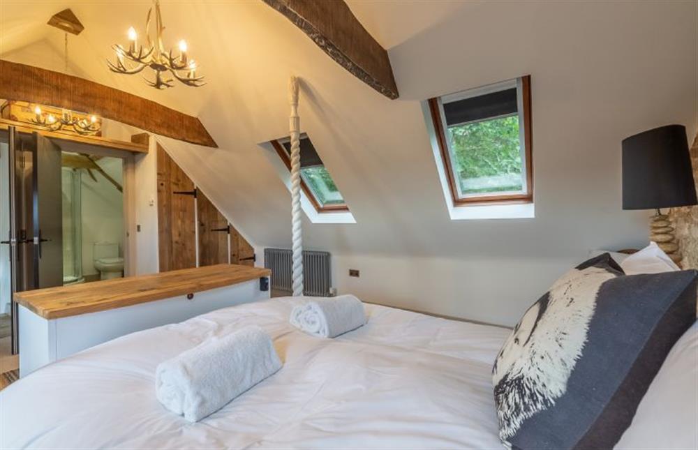 Second floor: Master bedroom has en-suite bathroom at Hideaway Barn, Thornham near Hunstanton