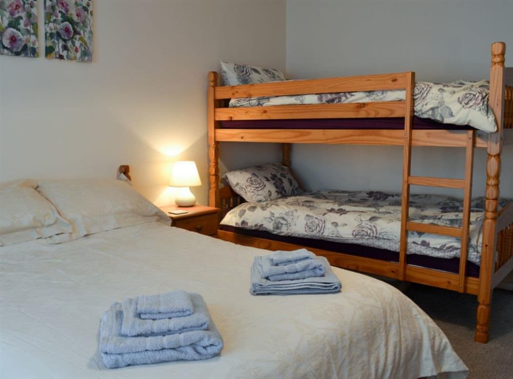 Double bedroom with additional bunk beds (photo 2) at Hideaway Cottage in Kingsgate, near Broadstairs, Kent