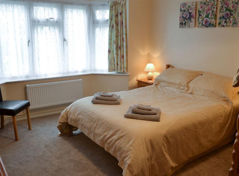 Double bedroom with additional bunk beds at Hideaway Cottage in Kingsgate, near Broadstairs, Kent