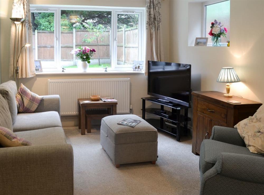 Living room with dining area at Hideaway Cottage in Kingsgate, near Broadstairs, Kent