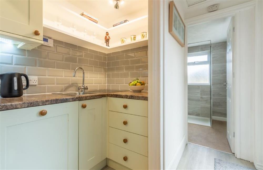 The shower room is accessed through the kitchen at the back of the cottage. at Hideaway Cottage, Leiston