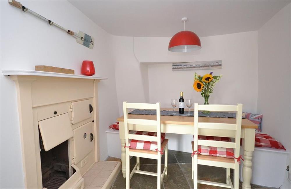 The dining area with antique range (not in use) at Hideaway, Harbertonford