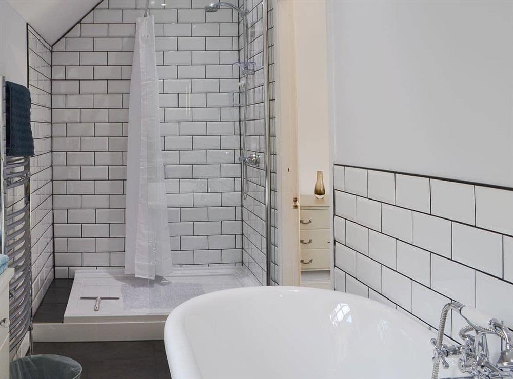 Bathroom with shower cubicle and bath at Hideaway in Kelso, Scottish Borders, Roxburghshire