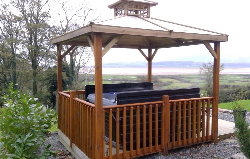 Outdoor hot tub with stunning views at High Bridge Haven, Kirkby-in-Furness