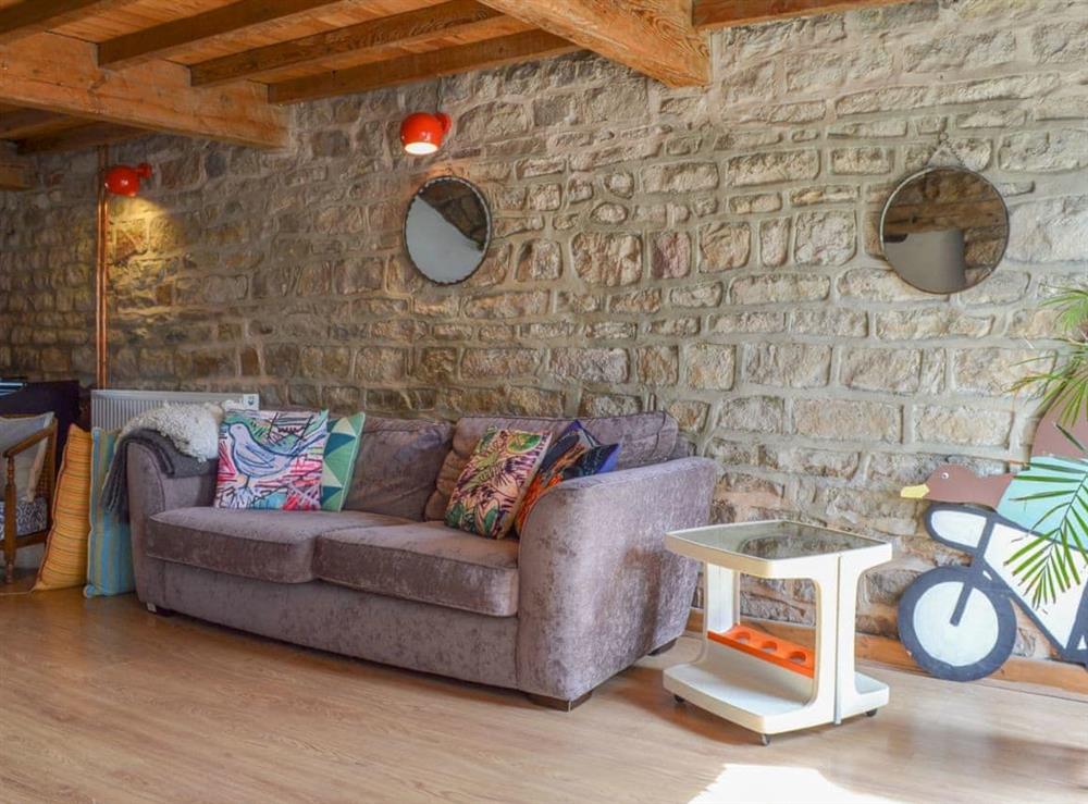 Lovely sopacious living room with exposed stone walls at High House Cottage in Addingham, near Ilkley, West Yorkshire
