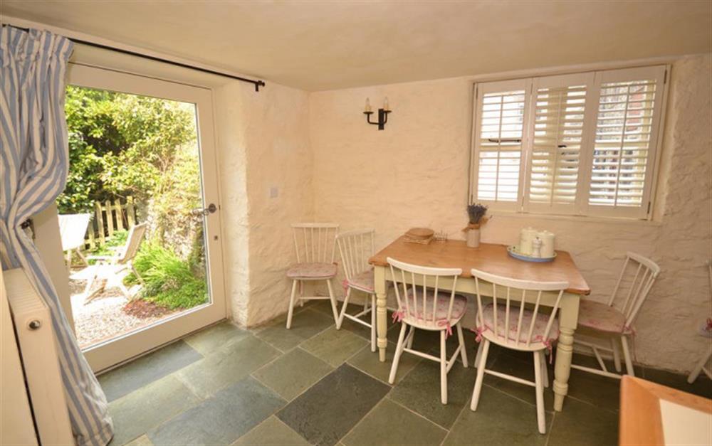 The dining area with patio doors to the rear courtyard. at High House Farm East Wing in East Portlemouth
