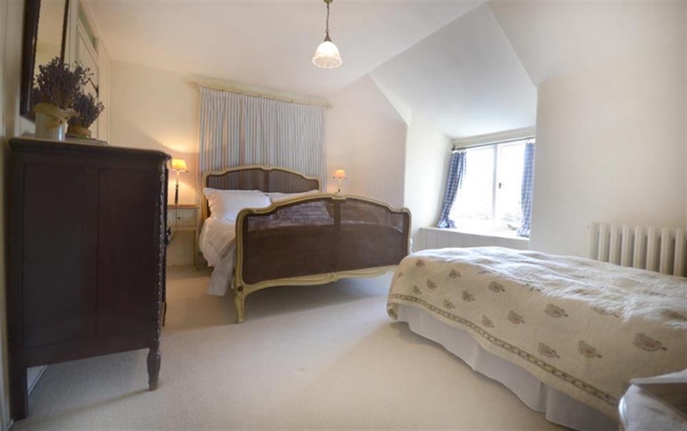 The master bedroom with additional childs bed at High House Farm East Wing in East Portlemouth