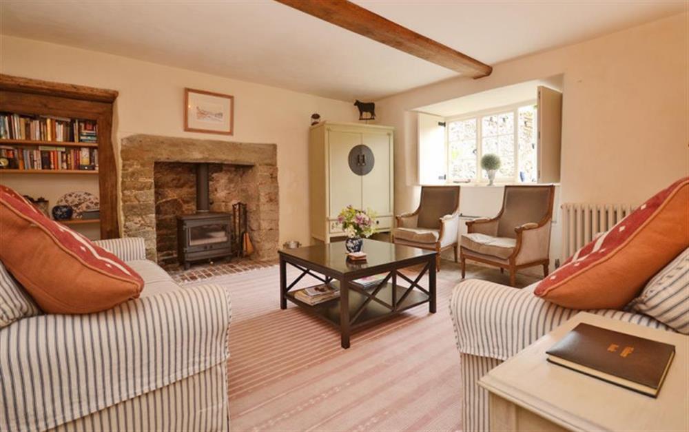 The spacious sitting room with wood burner stove. at High House Farm East Wing in East Portlemouth