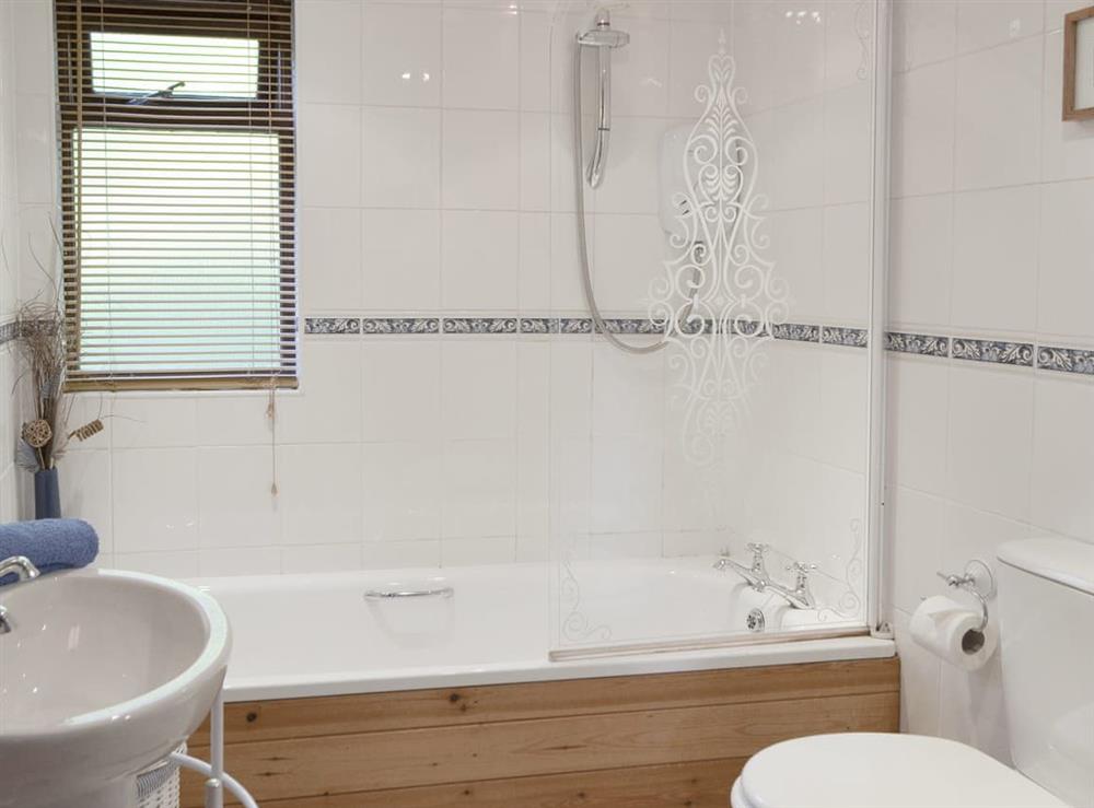 Bathroom with shower over bath at Wheelwrights, 