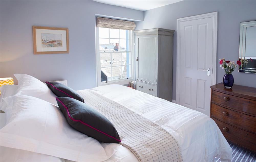 Second floor bedroom with a 5’ king-size bed (photo 2) at High House (Sleeping 10), Tenby