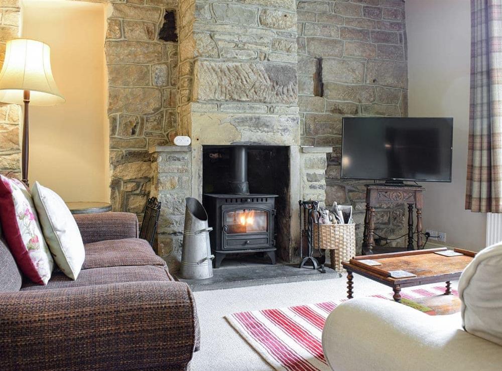 Living room with wood burner at High House in Wath, near Pateley Bridge, North Yorkshire