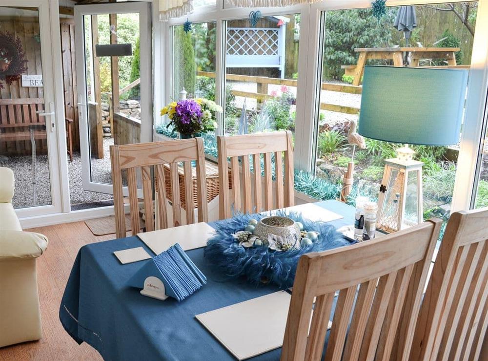 Comfy conservatory-breakfast room opens to undercover garden space at High Lanes in Praze-an-Beeble, near Hayle, Cornwall