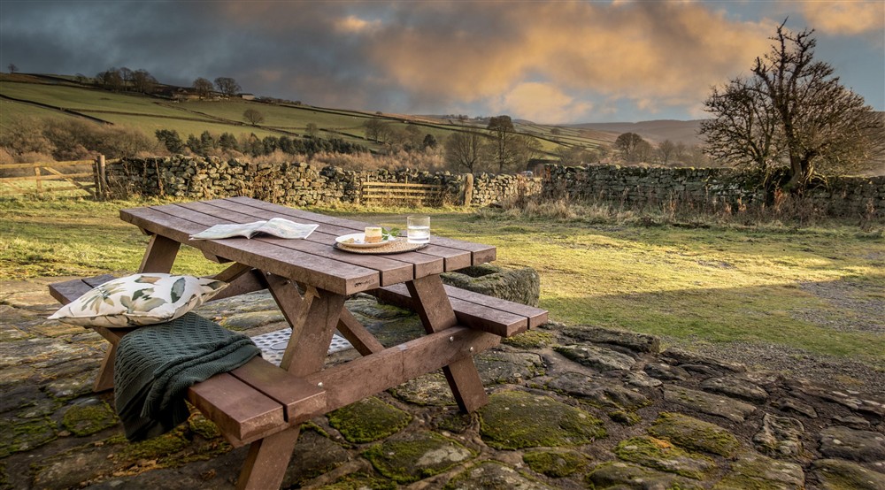 The picnic table in the garden at High Lidmoor Farmhouse in Kirkbymoorside, North Yorkshire