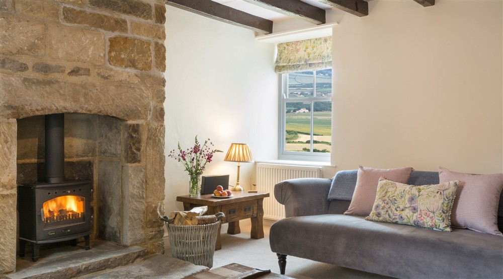 The fireplace in the sitting room at High Peak in Scarborough, North Yorkshire