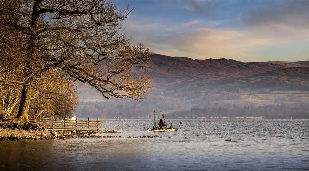 A kayaker on Lake Windermere, Cumbria at High Strawberry Gardens in Near Hawkshead, Cumbria