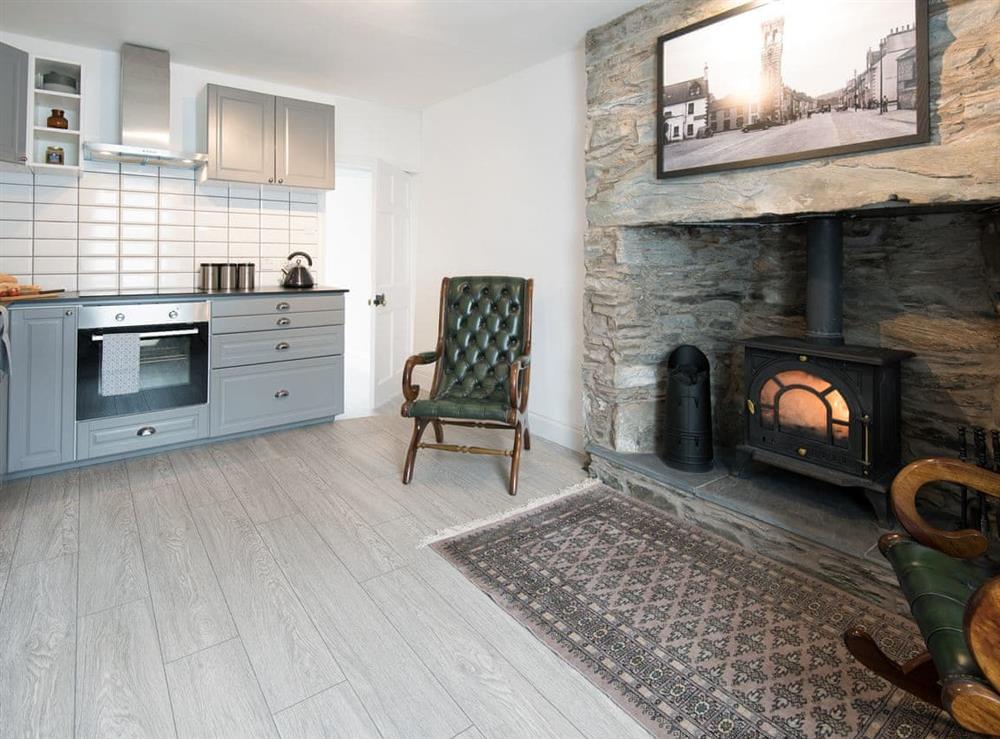 Thoughtfully renovated kitchen with wood burner at High Street in Gatehouse of Fleet, Dumfries and Galloway, Kirkcudbrightshire