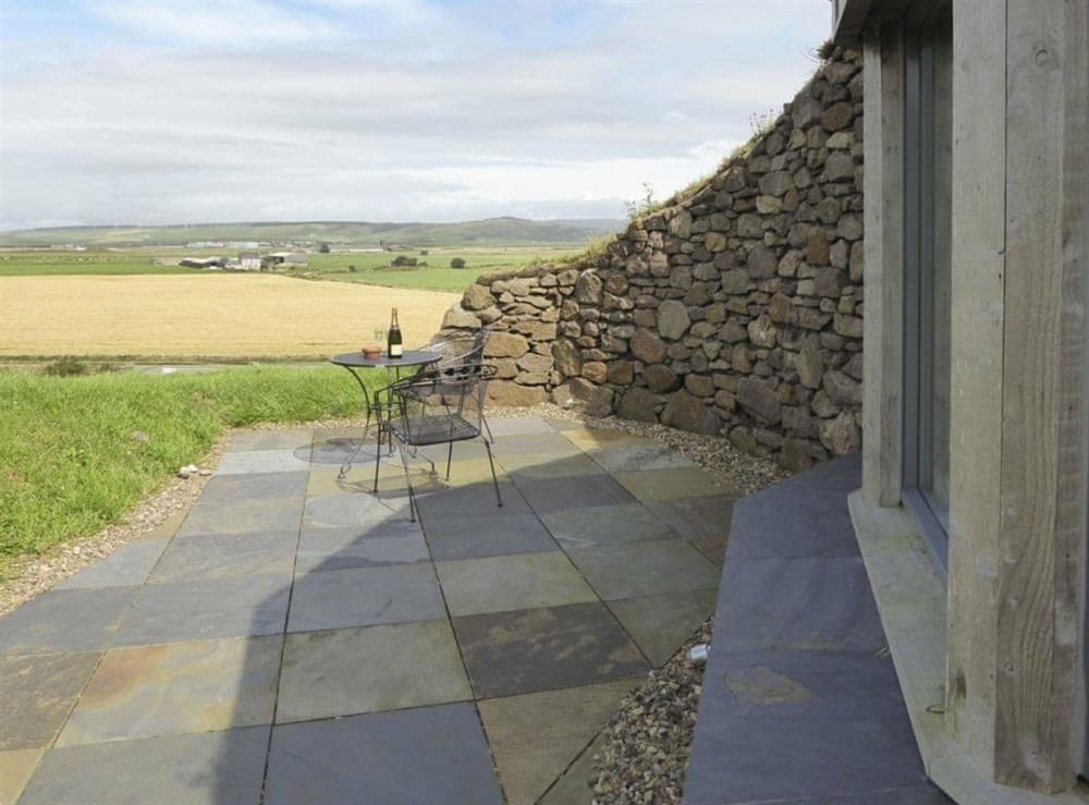 Paved patio area with outdoor furniture at High Trodigal in Machrihanish, near Campbeltown, Argyll