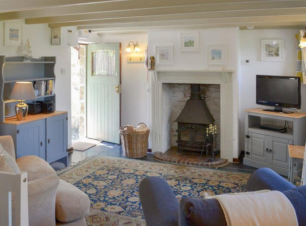 Charming living/ dining room with cosy wood burner at High View in St Breward, Cornwall