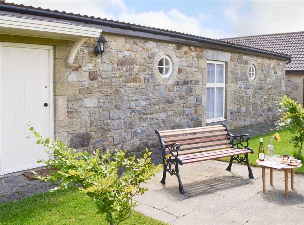 Paved patio area with outdoor furniture at Lapwing Cottage, 
