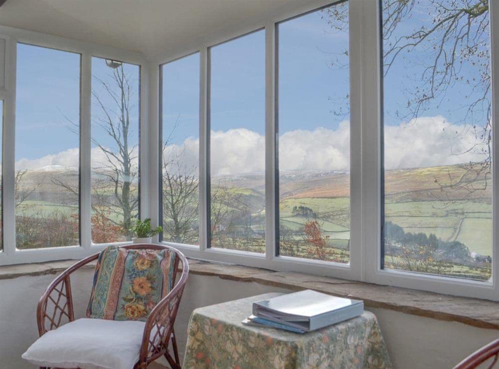 Airy conservatory with wonderful countryside views at High Windy Cottage in Garrigill, near Alston, Cumbria