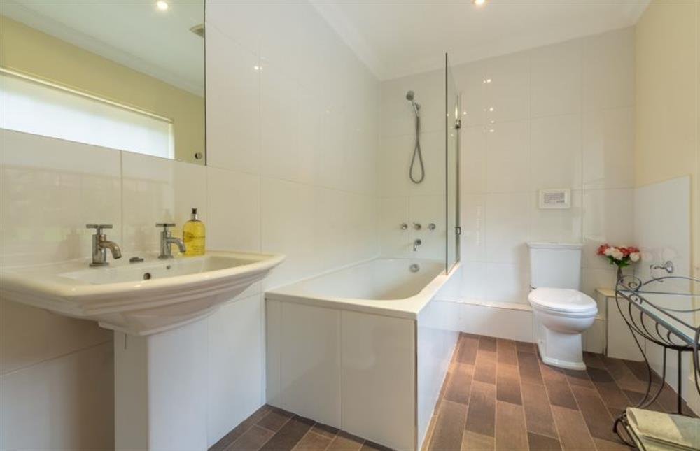 Bathroom with bath and shower over at Higham Place Lodge, Higham
