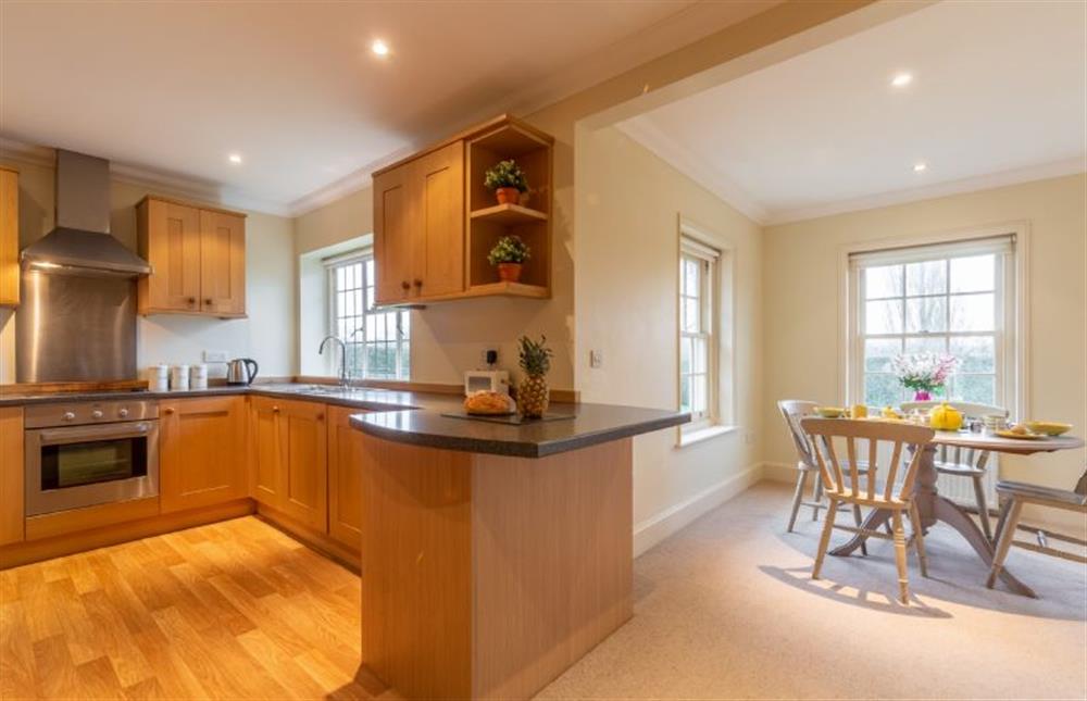 Kitchen with views to dining table at Higham Place Lodge, Higham